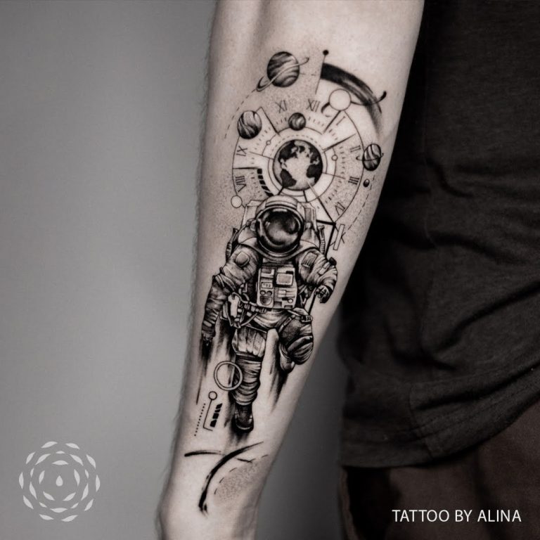 Liquid Amber Tattoo Black and grey realism tattoo of astronaut with geometric elements by Alina 768x768