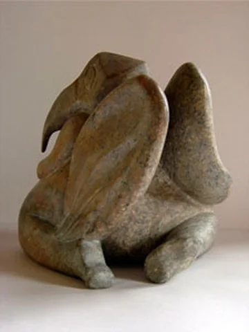 birdwoman kneels to kiss the earth rear view brazilian soapstone 9x9.5in